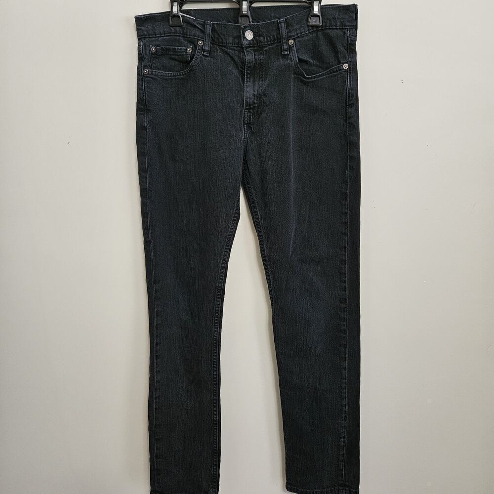 Levi's Men's Regular Fit Jean, 33Wx32L measures 31.5 Black VGUC